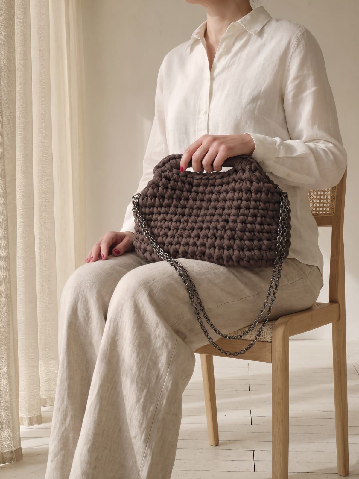 DUNJA in mocha, resting in her lap